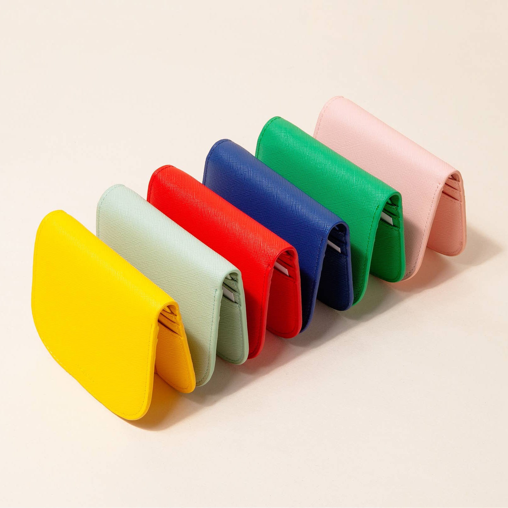 Set of colorful wallets on a light background
