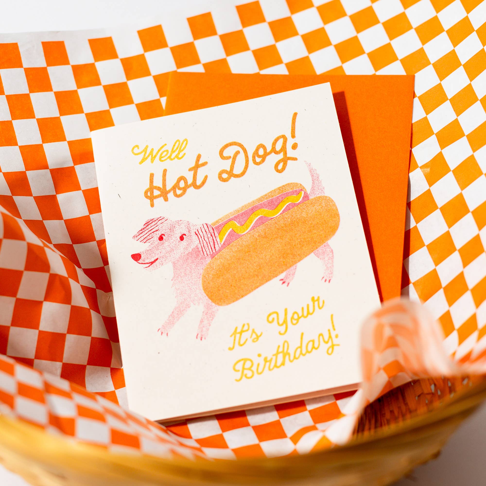 Birthday card with hot dog illustration on a checkered background