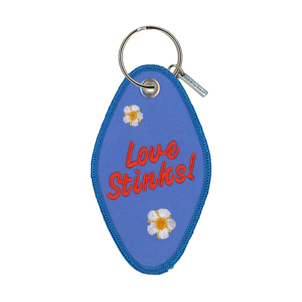 Blue keychain with 'Love Stinks!' text and flowers on a clear background