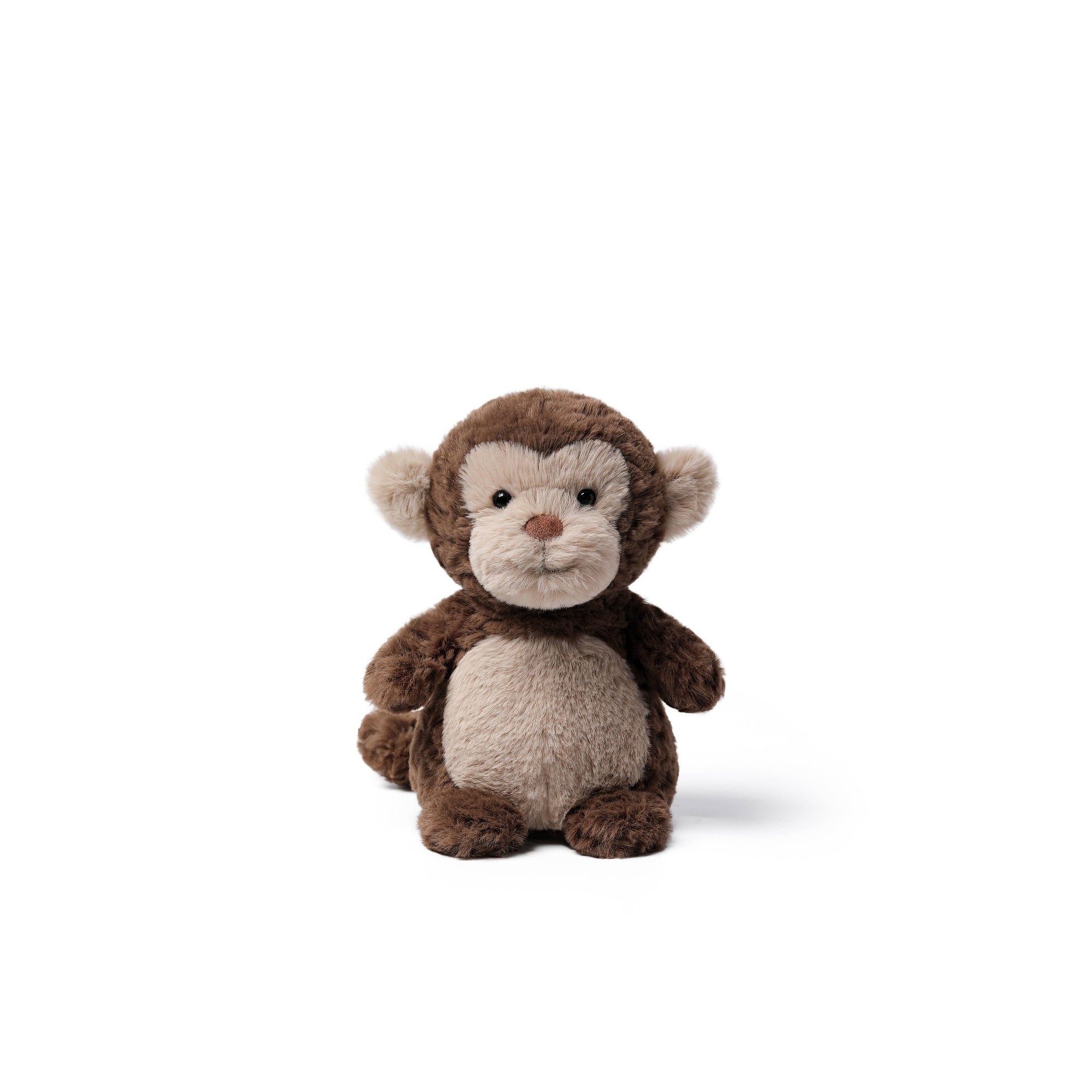 A small plush monkey toy with dark brown fur, a lighter beige face and belly, and small pinkish-brown ears and nose, photographed on a clean white background.