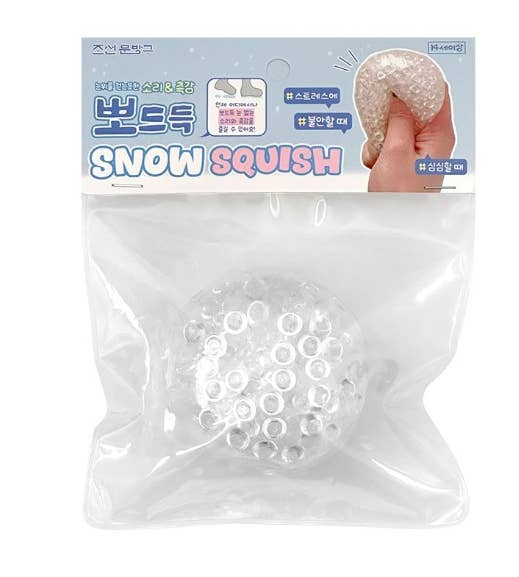 Snow Squish product packaging with a clear bag showing white foam balls.