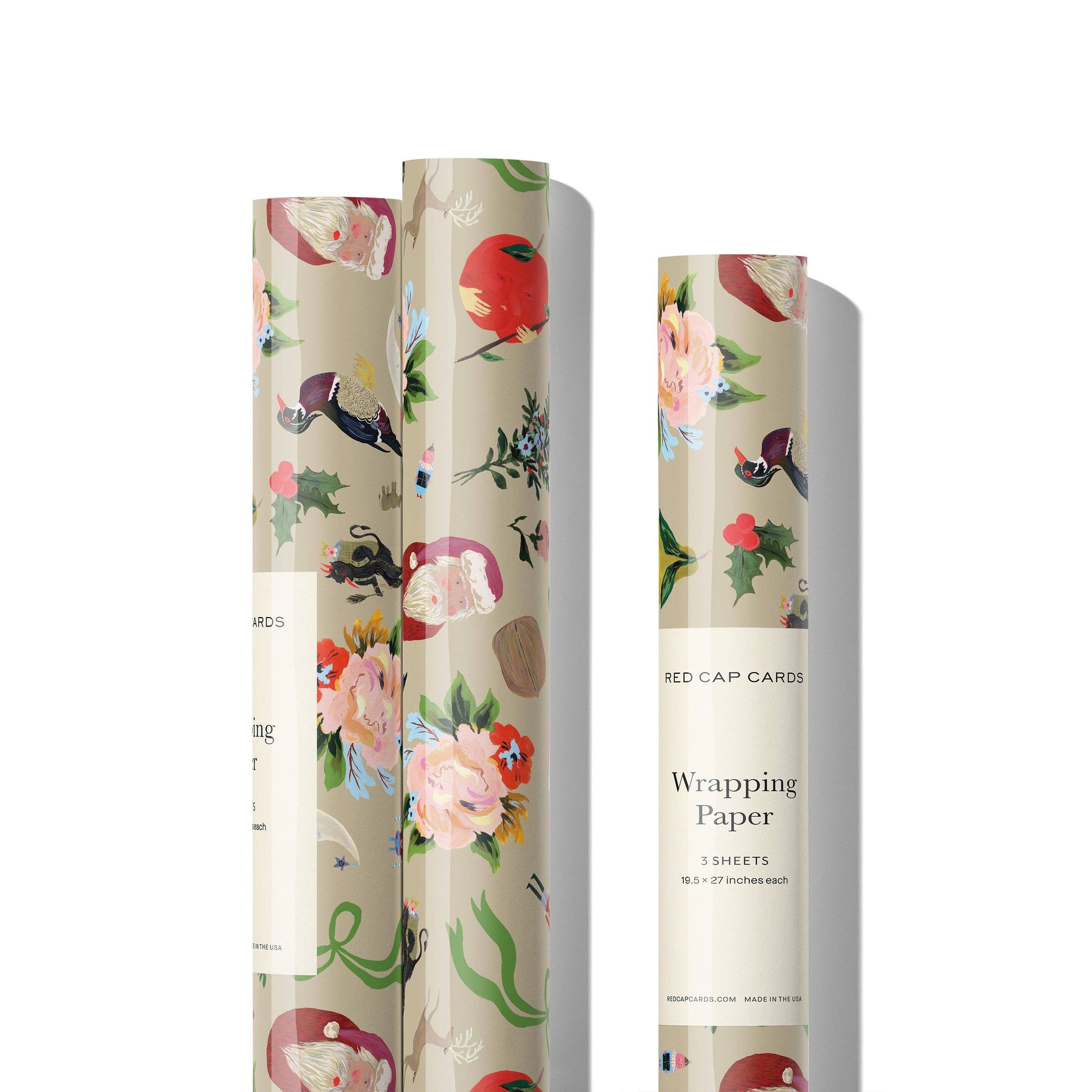 Three rolls of floral wrapping paper with 'Red Cap Cards' branding on a white background.