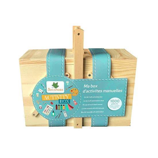 A wooden activity box with a light natural wood exterior, teal fabric straps, and a colorful oval label reading 'Activity Box' and 'Ma box d'activites manuelles'.