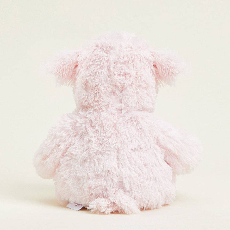 Fluffy pink plush toy on a light background