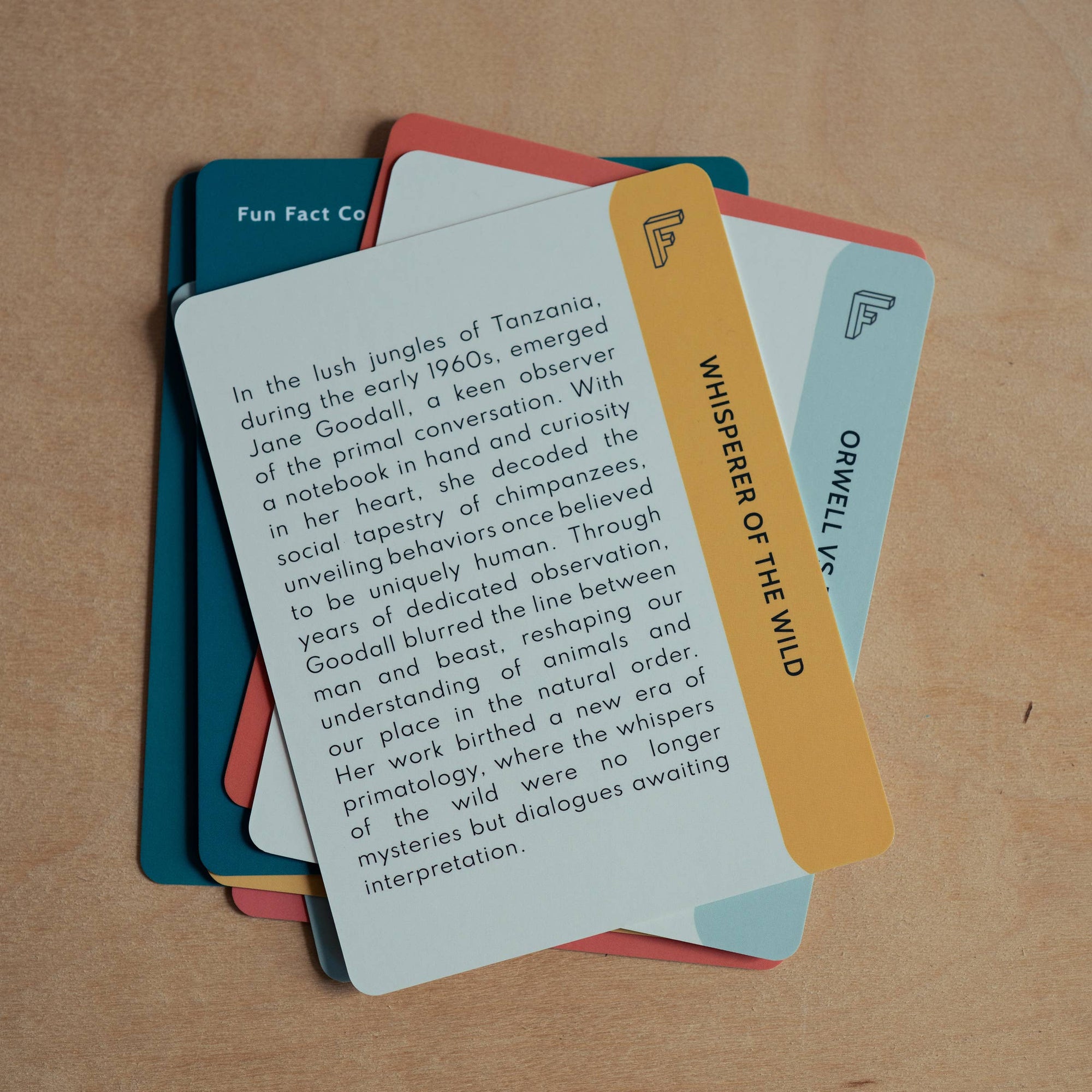 Stack of informational cards on a wooden surface