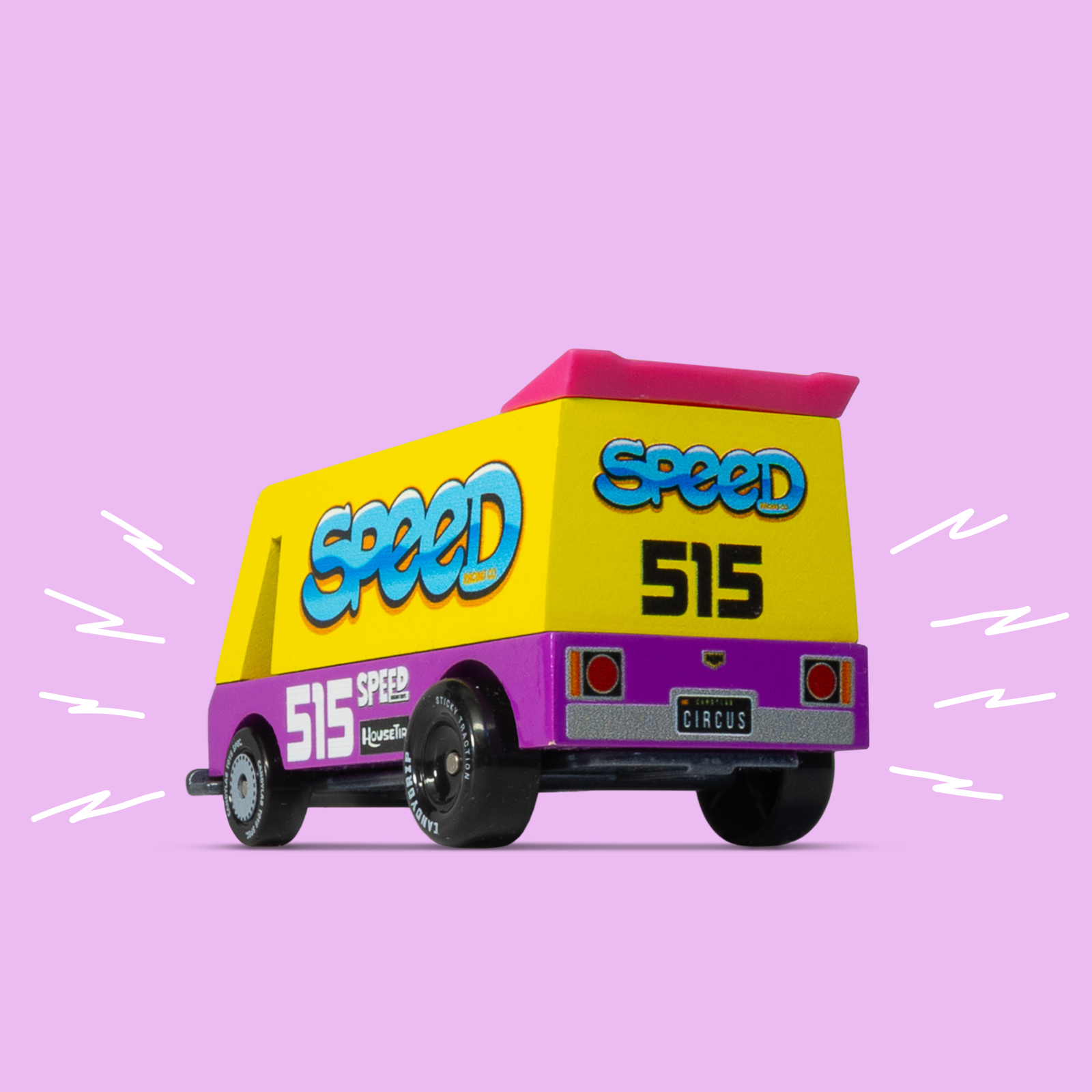 Toy truck with 'speed' and '515' branding on a pink background