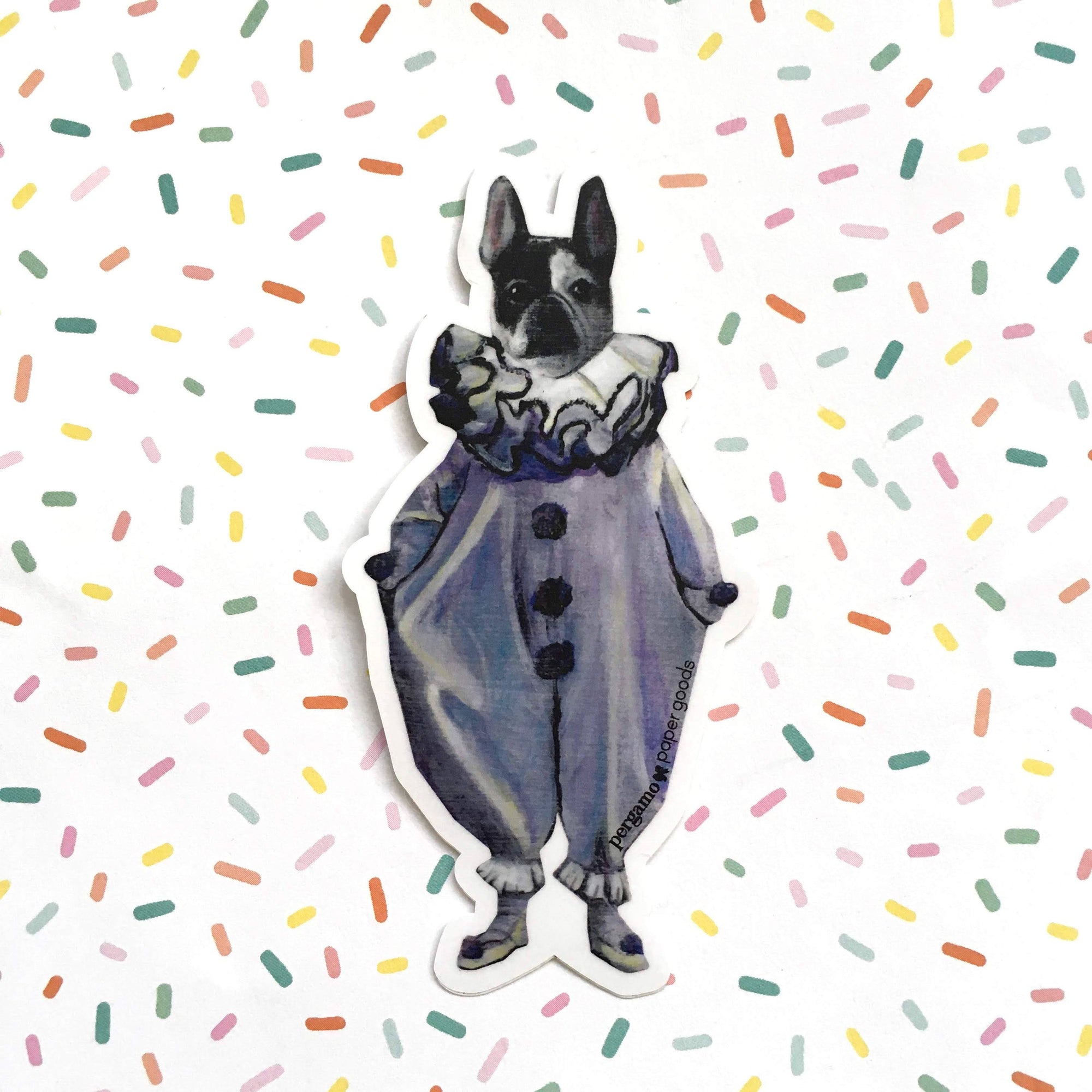 Sticker of a dog in a blue outfit on a sprinkles background