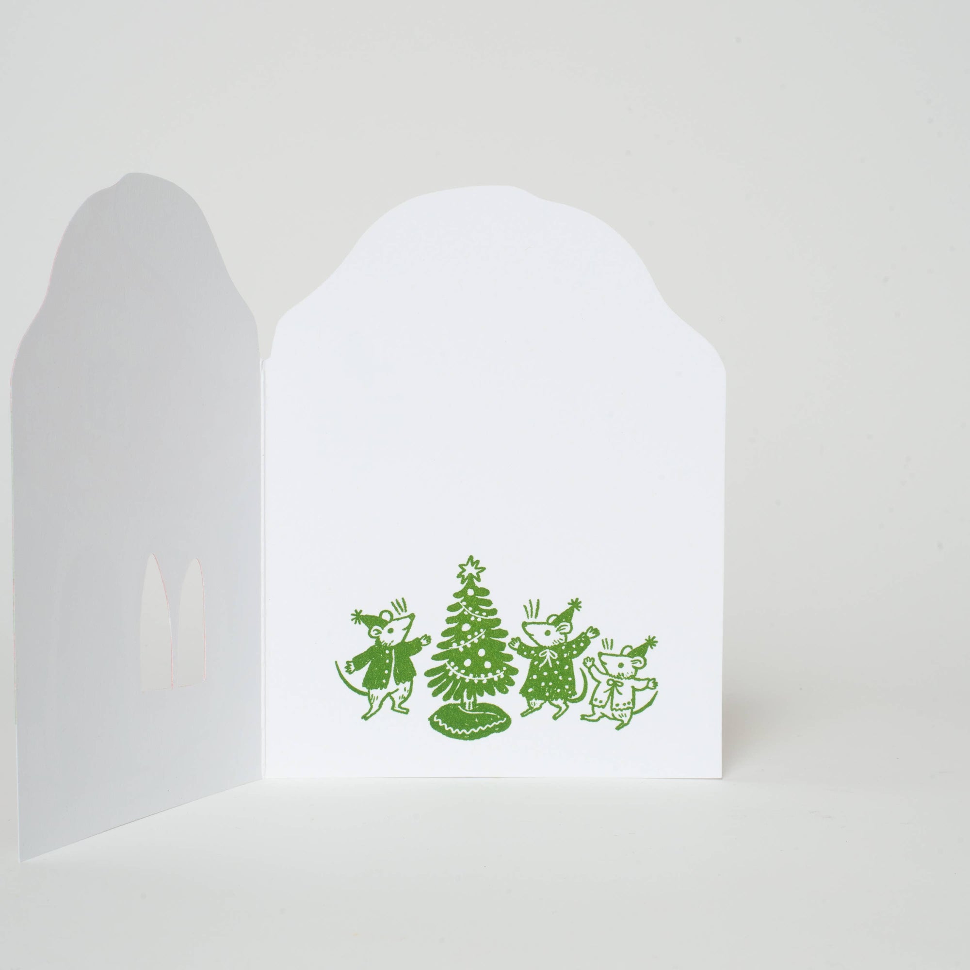 White greeting card with green illustrations of people and a tree on a white background