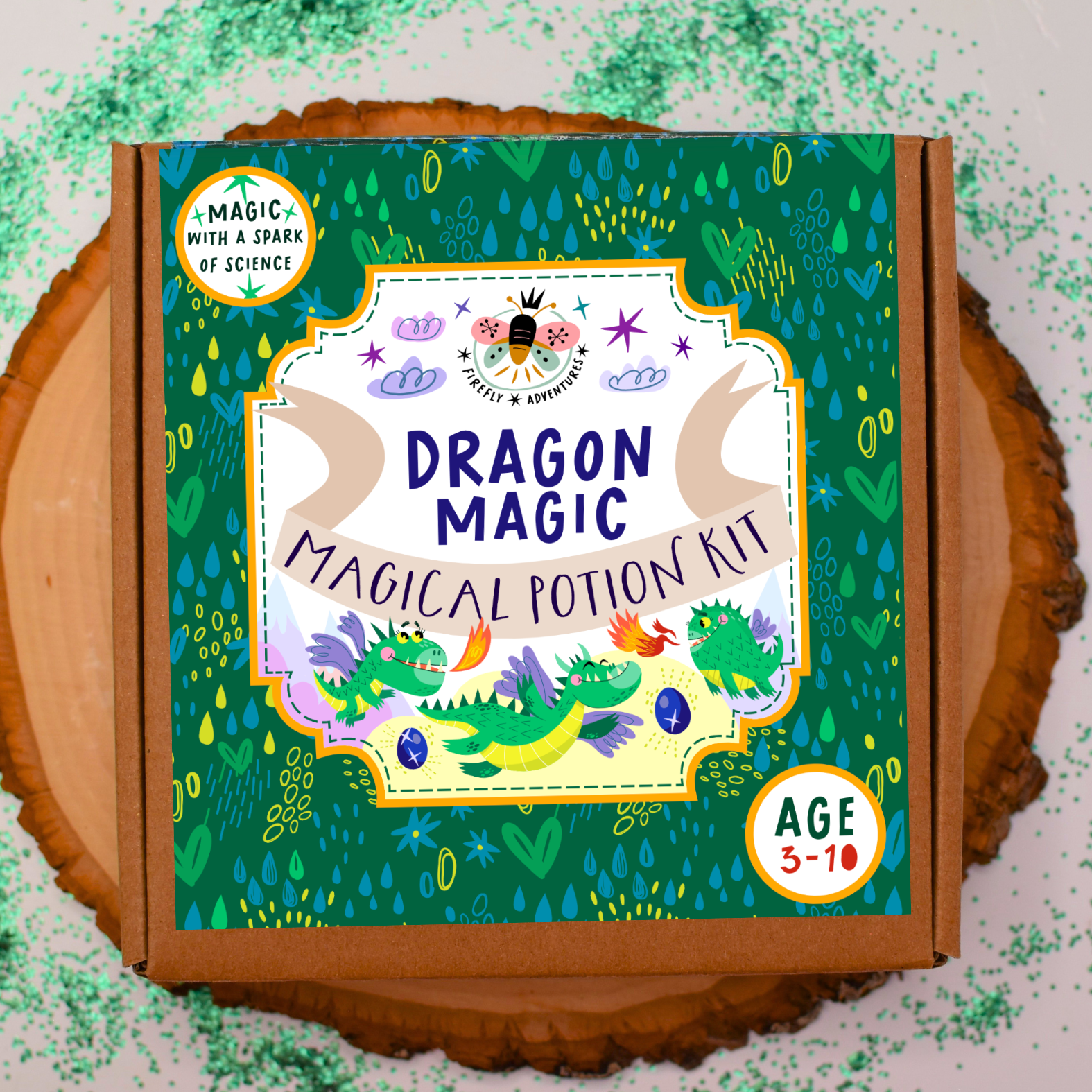 Dragon Magic Magical Potion Kit packaging on a wooden surface with green sprinkles.