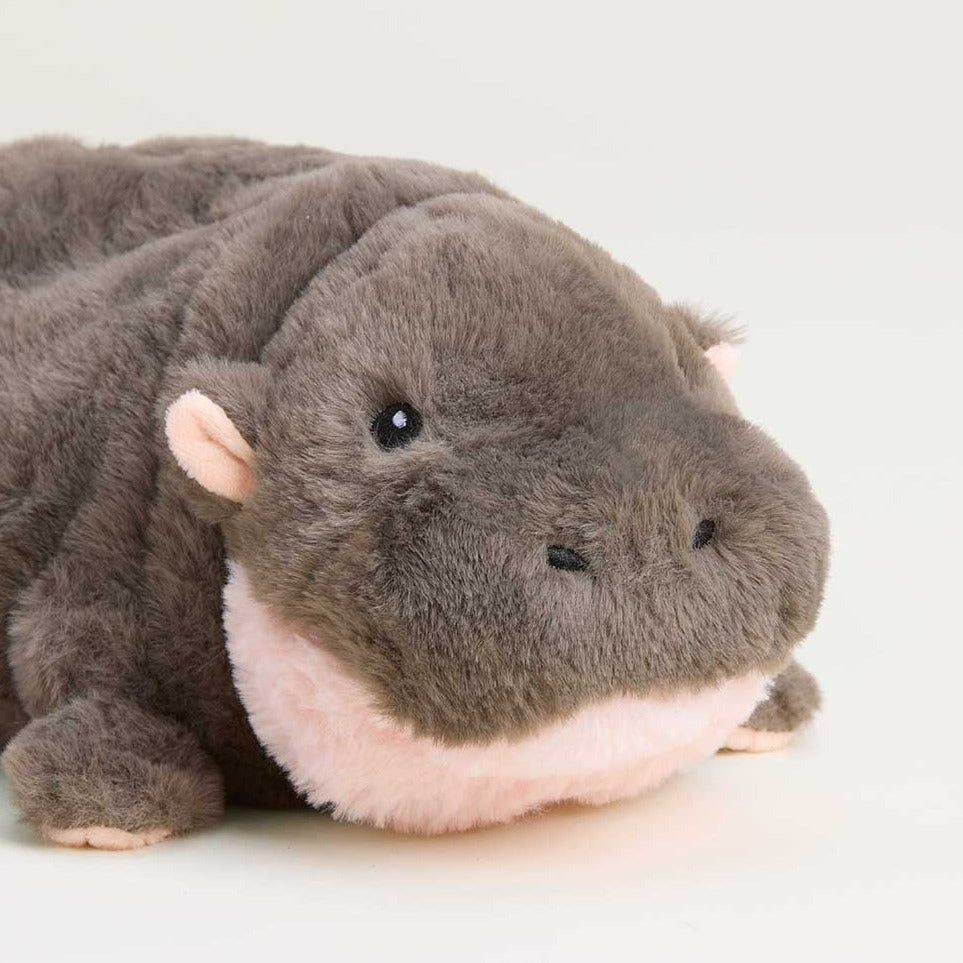 Plush toy hippo on a white background