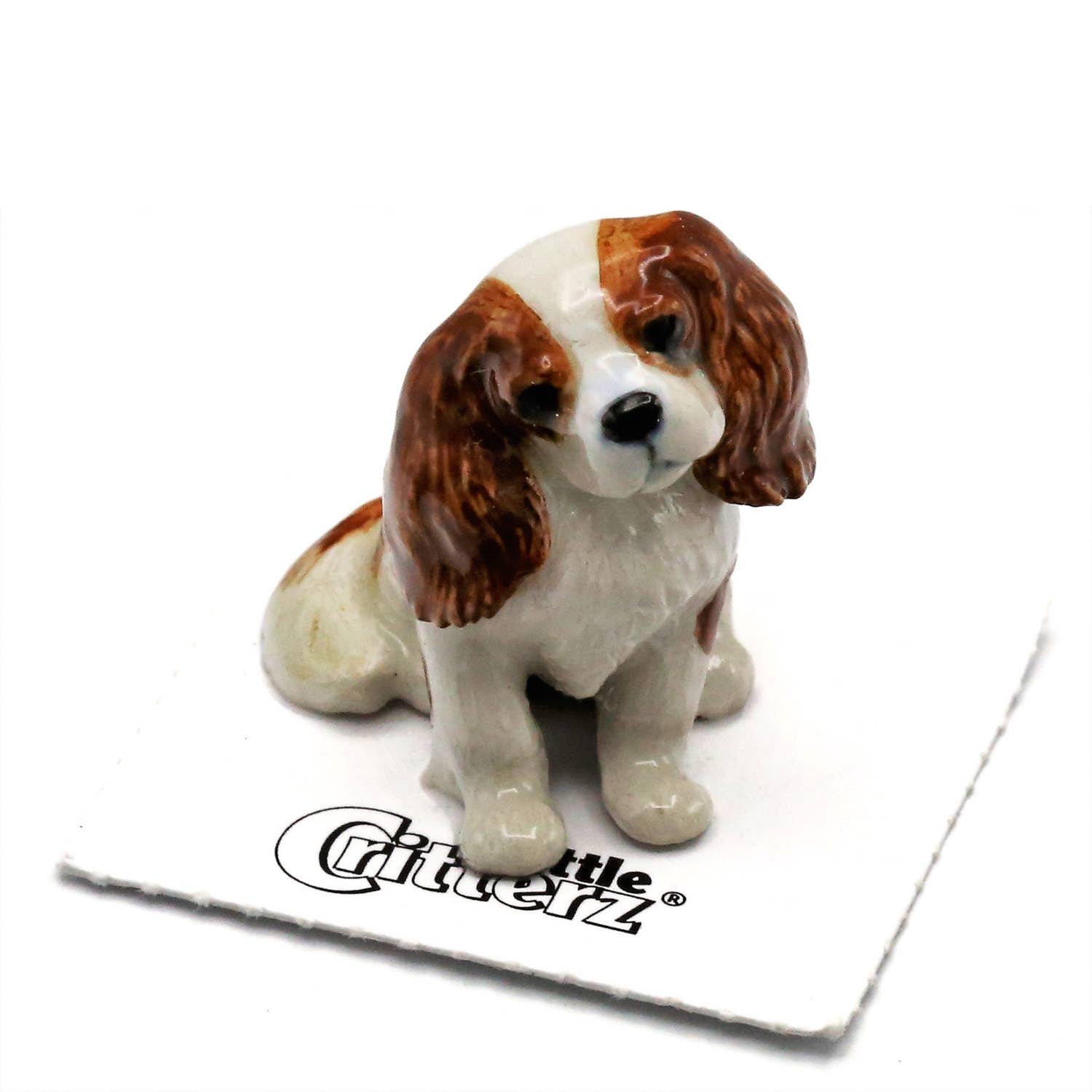 Small ceramic dog figurine on a white background with 'Little Critterz' branding.