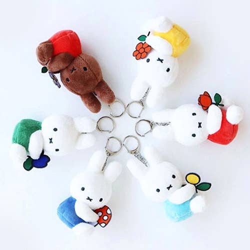 Set of cute plush keychains on a white background