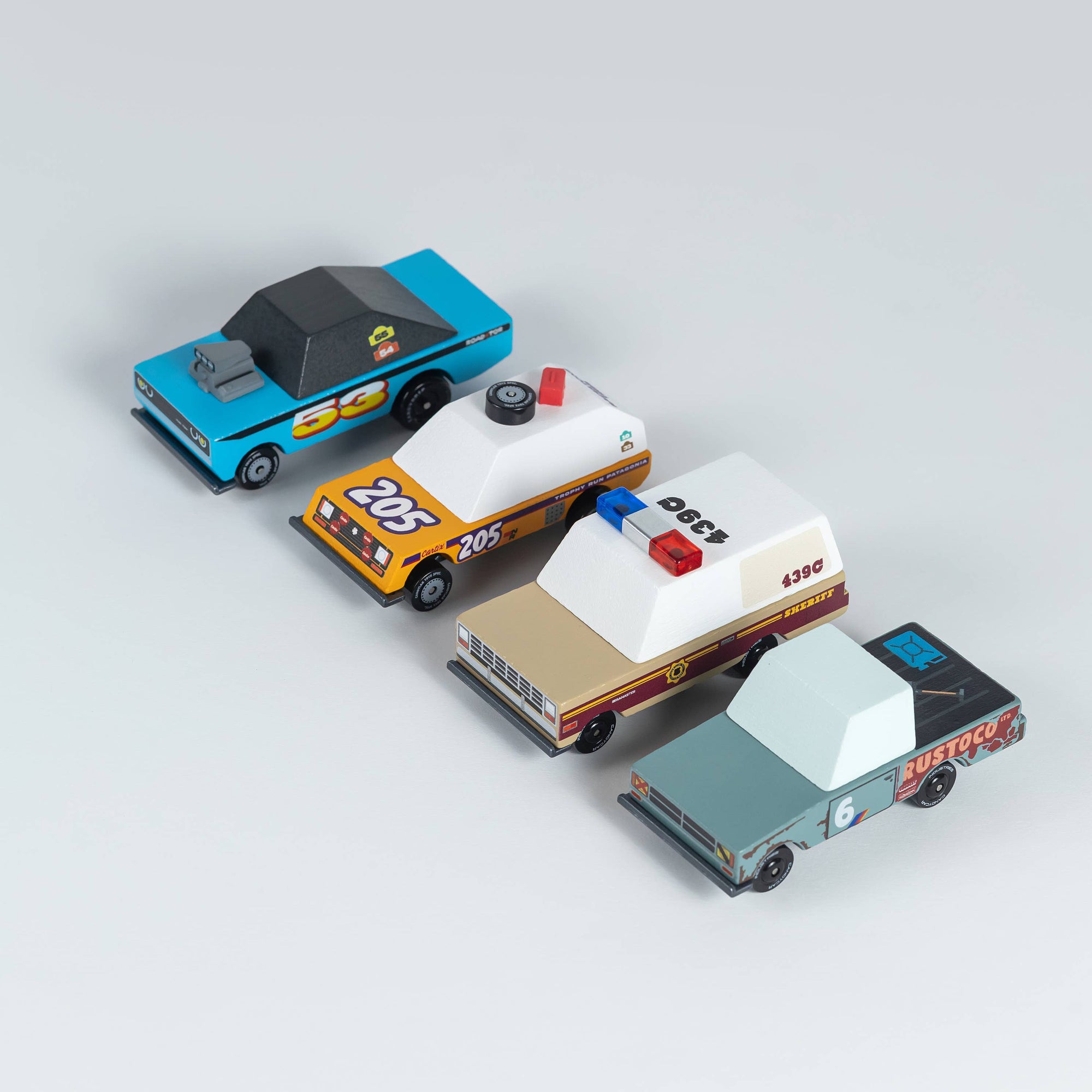 Set of toy police cars on a light gray background