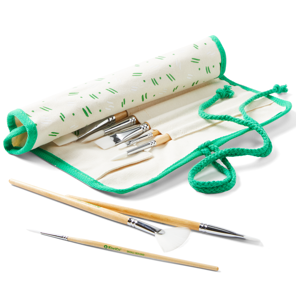 A set of knitting needles and tools in a rolled cream canvas case with green trim and a green drawstring, shown on a white background.