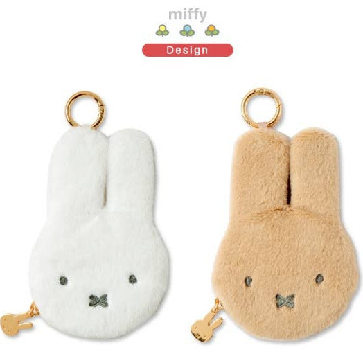 Two plush keychains shaped like rabbits, one white and one beige, on a white background.