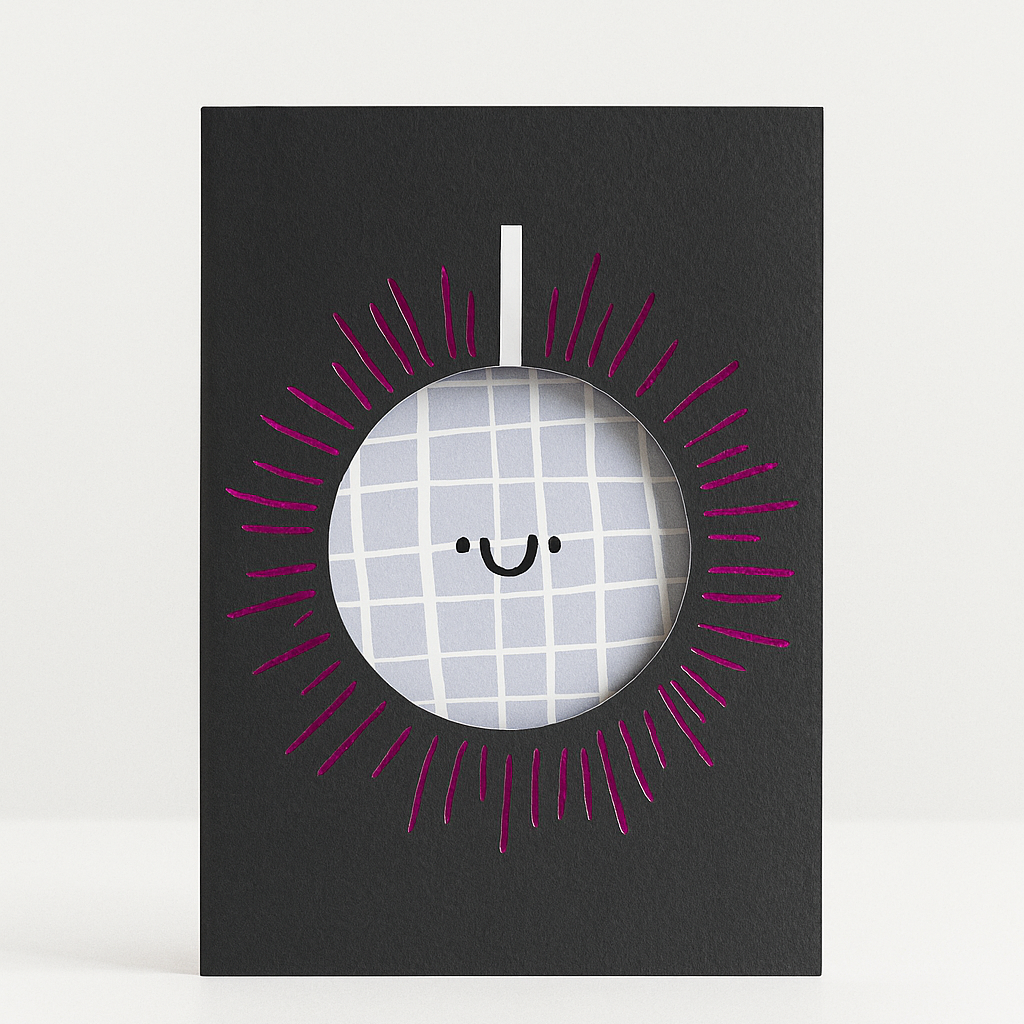 Framed picture of a smiley face with a checkered pattern on a black background