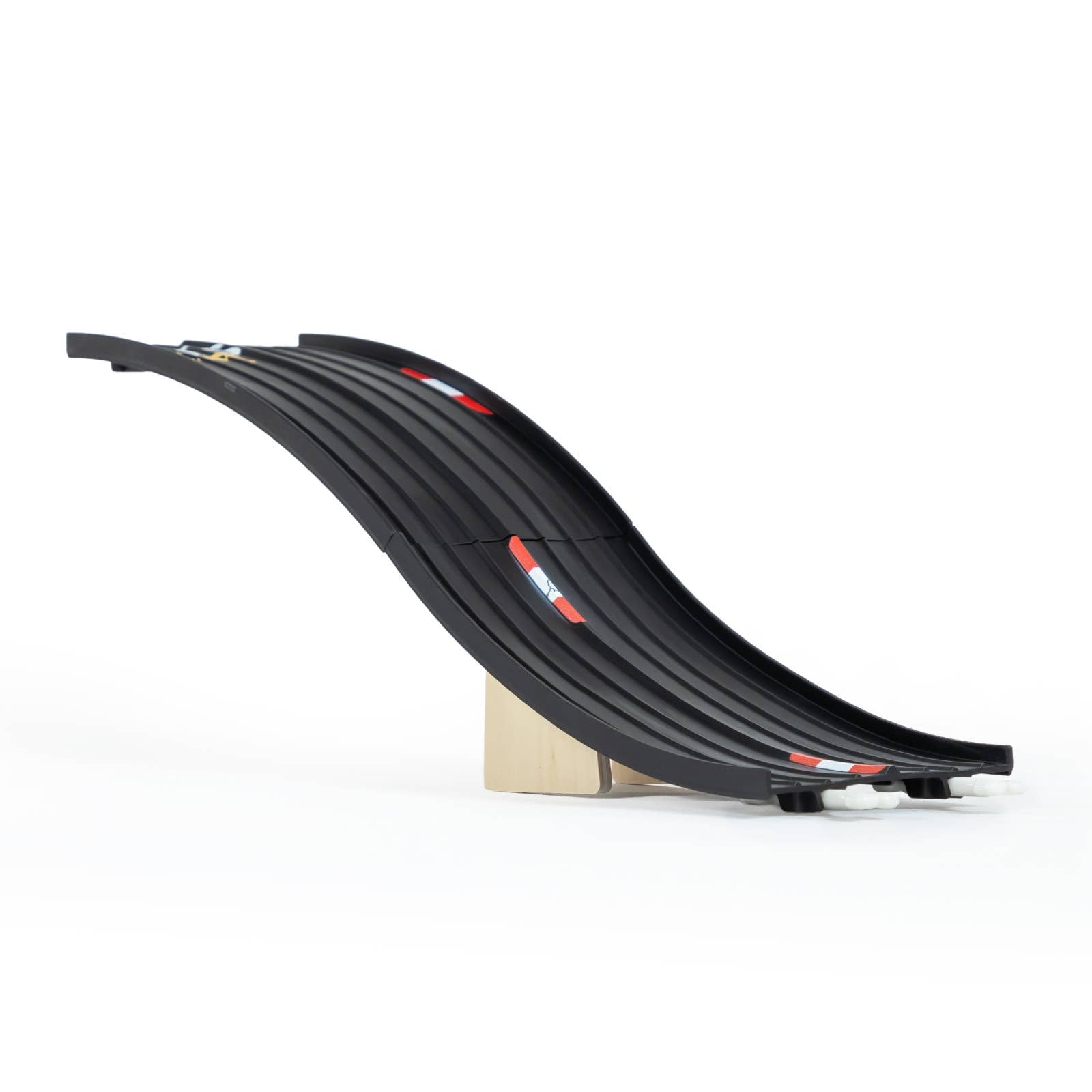 Black toy track with red lights on a white background