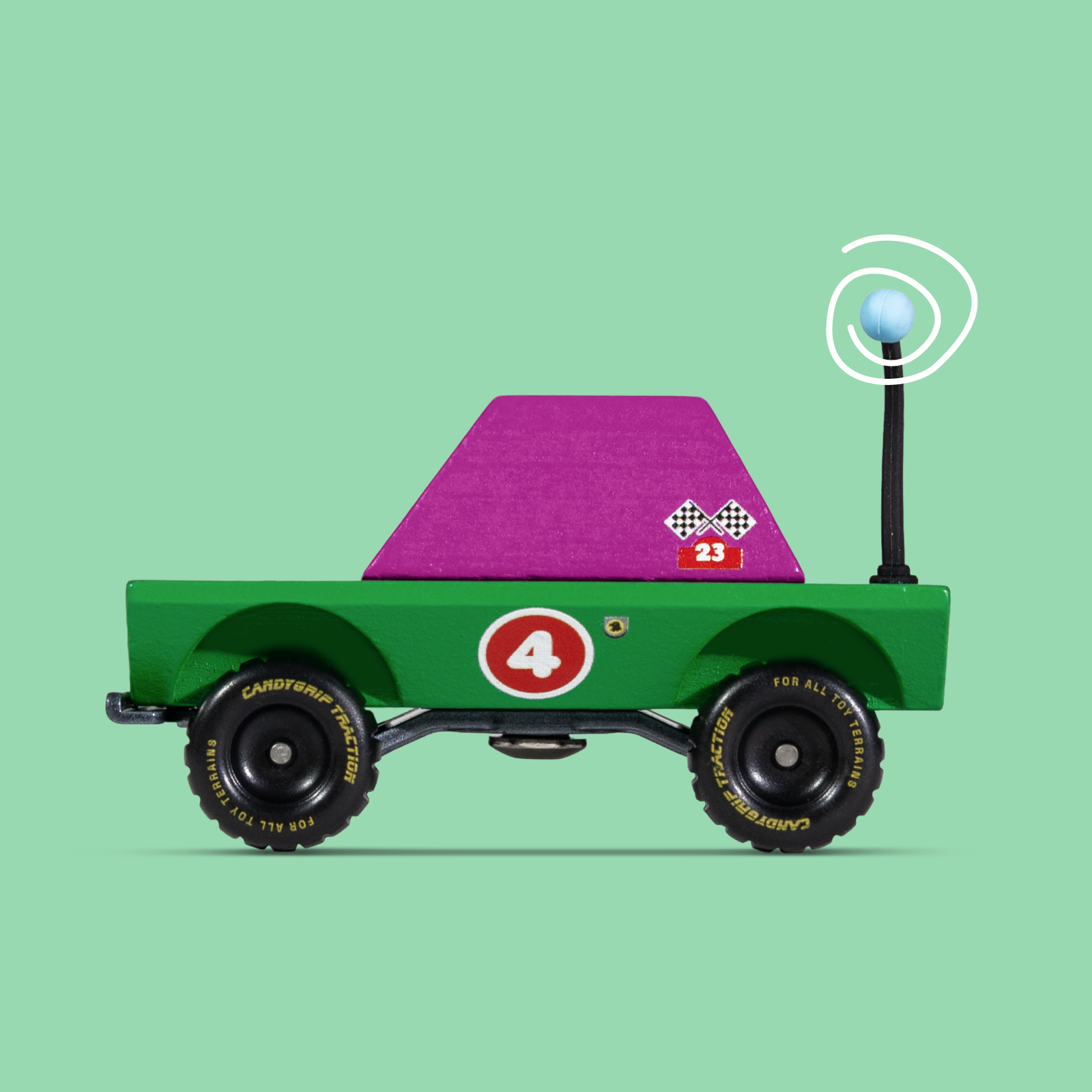 Toy truck with a purple flatbed on a green background
