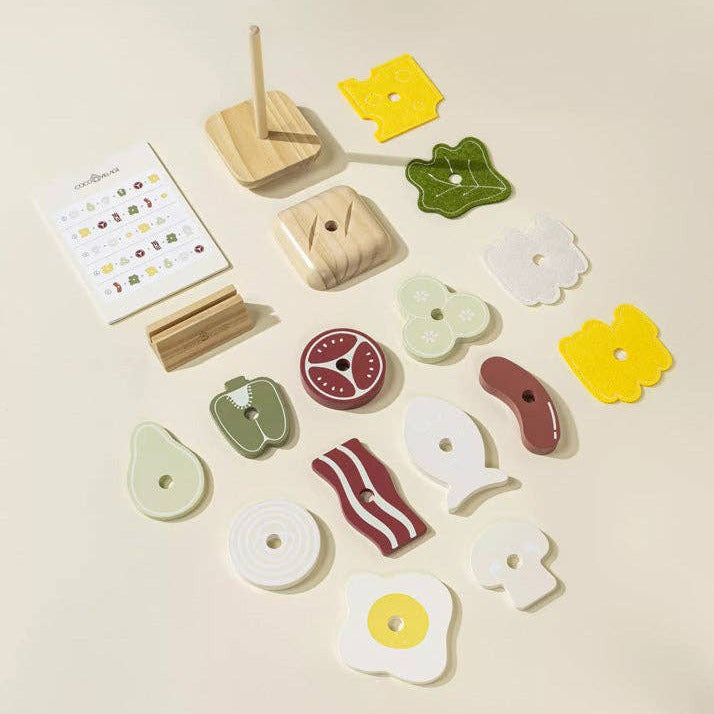 Set of wooden toys with various shapes and colors on a beige background