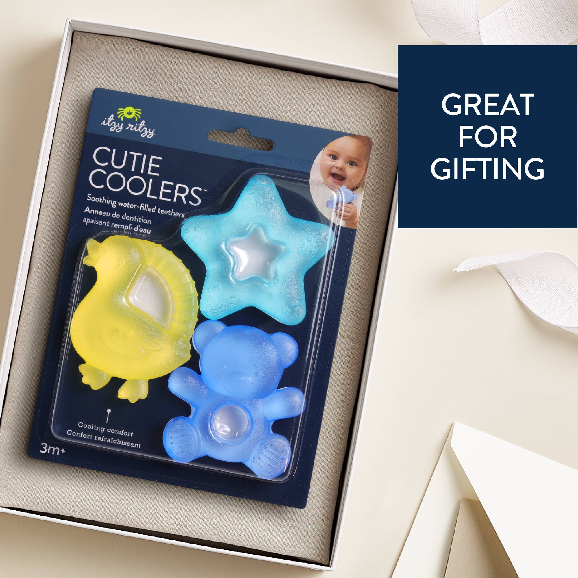 Packaged 'Cutie Coolers' with star, bear, and duck shapes on a beige background.