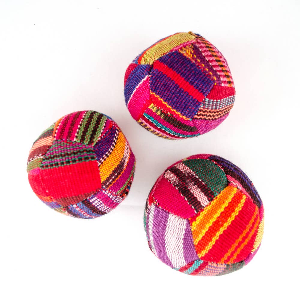 Three colorful woven balls on a white background
