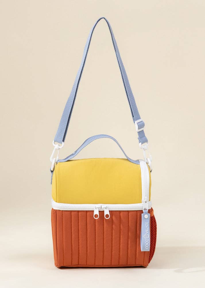 Multicolored bag with a yellow front panel and brown base on a beige background