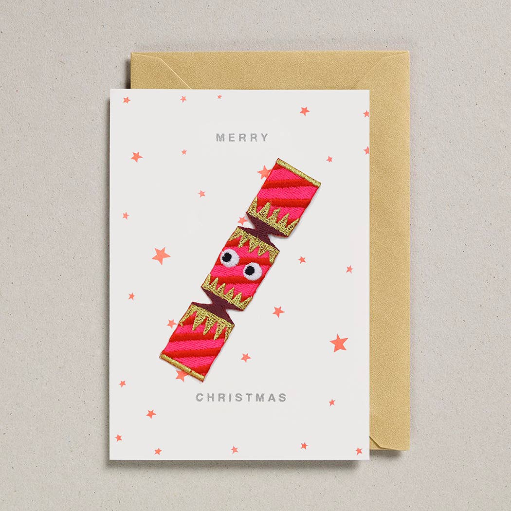 Greeting card with candy cane design and 'Merry Christmas' text on a beige background