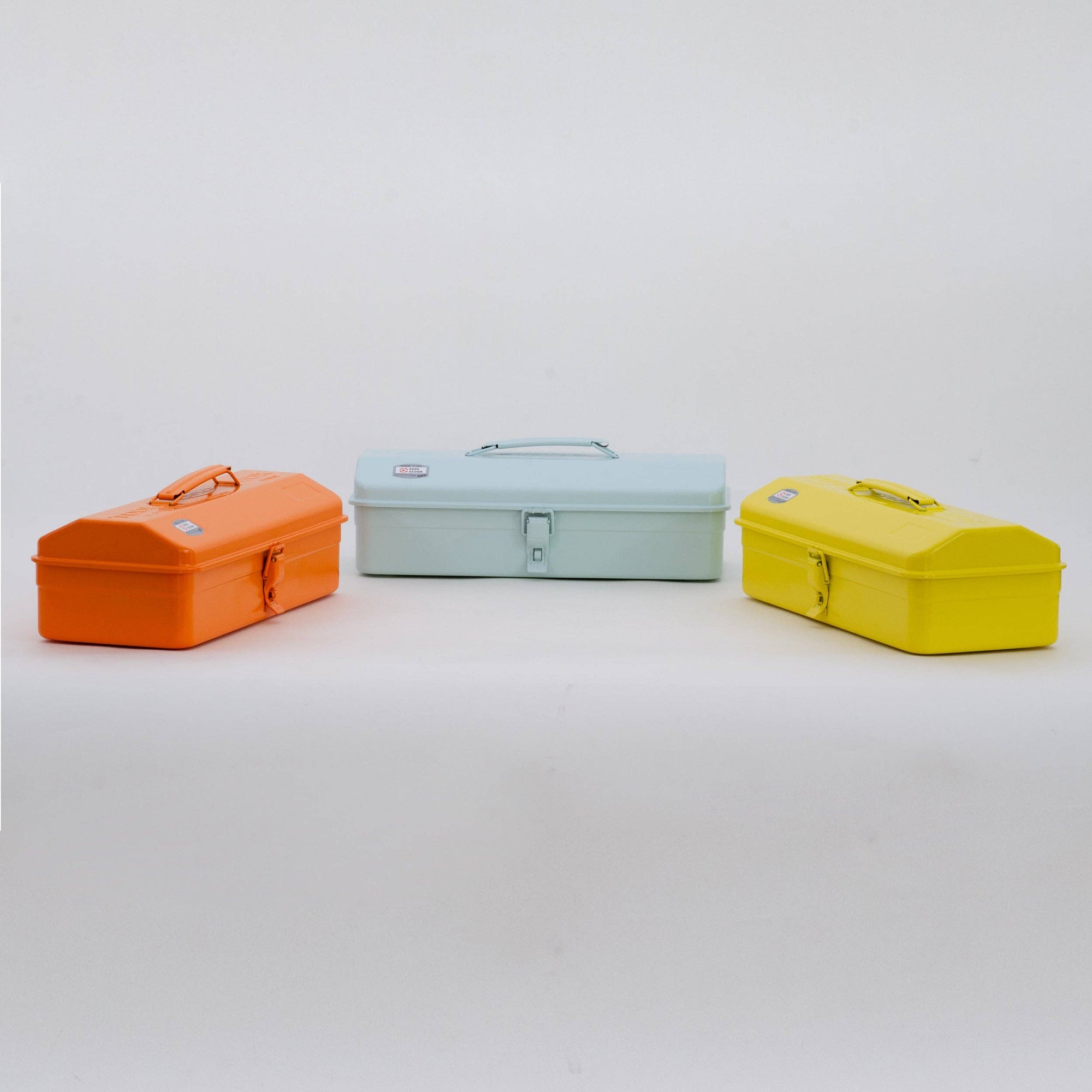 Three colorful toolboxes (orange, light blue, yellow) on a white background