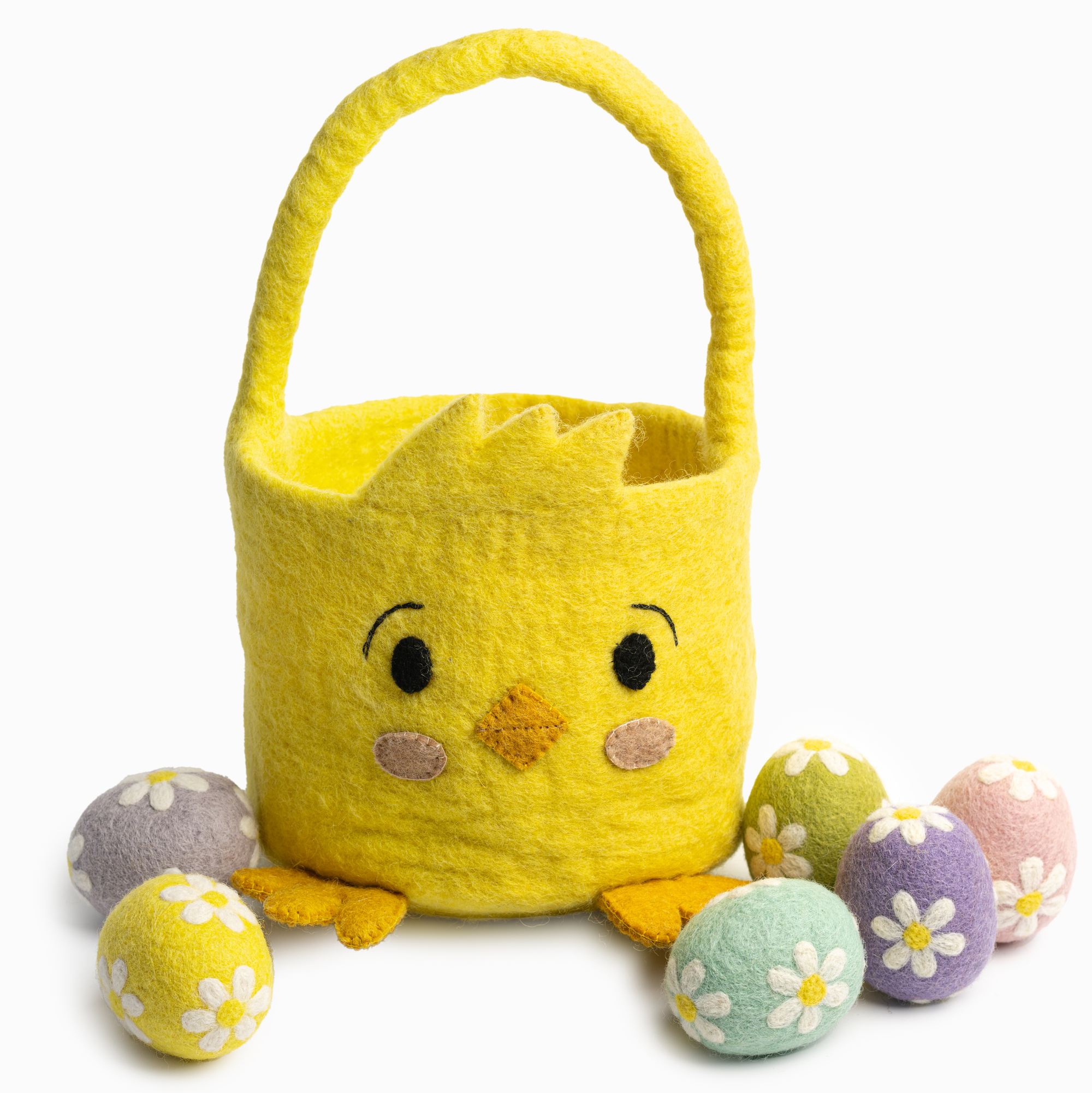 Yellow felt Easter basket with a chick face design, surrounded by colorful eggs on a white background.