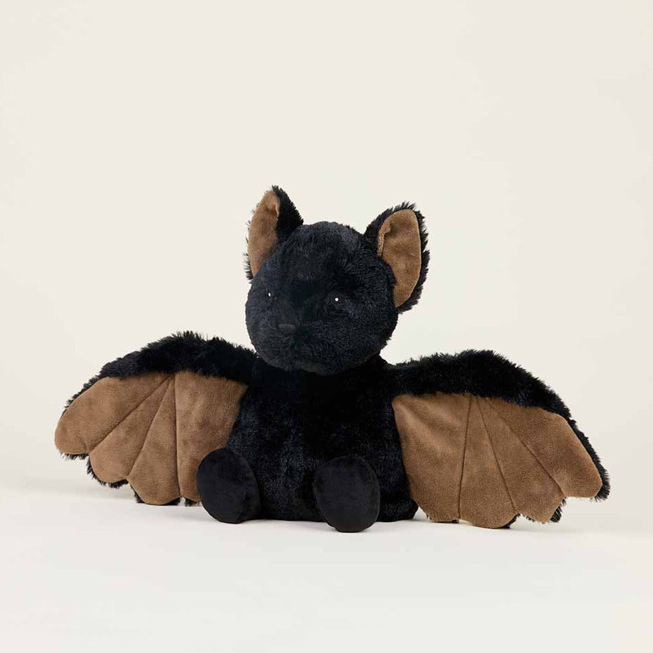 Plush toy dragon with black body and brown wings on a white background
