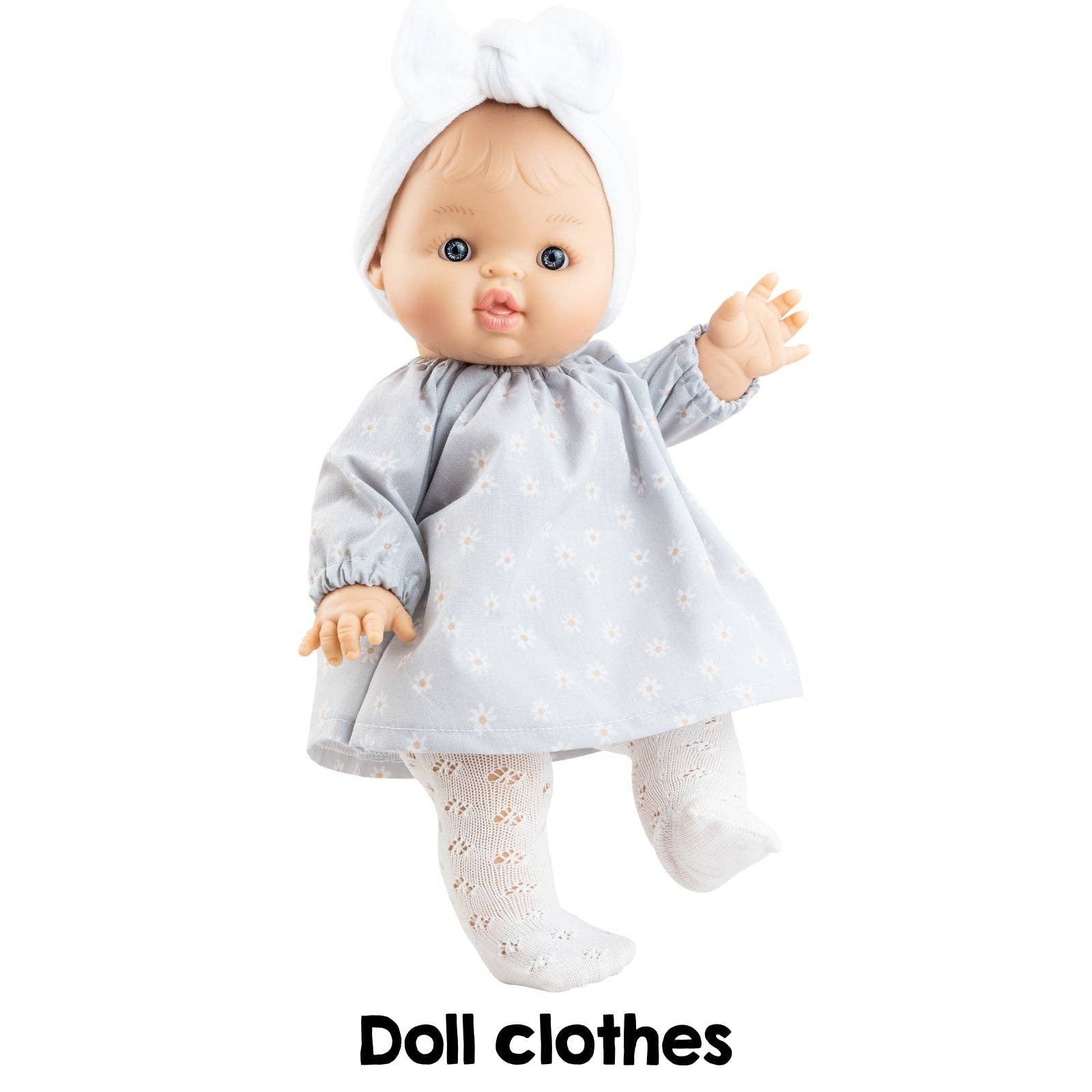 Doll wearing a gray dress with text 'Vétements pour poupèe' and 'Doll clothes' on a white background