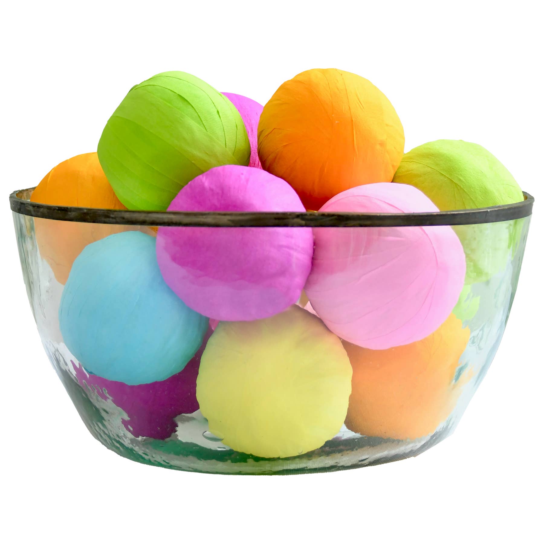 Glass bowl filled with colorful surprise balls on a white background