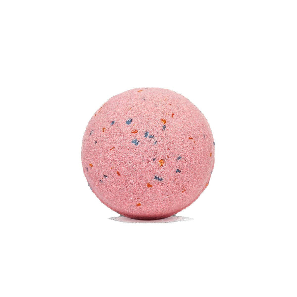 Pink bath bomb with speckles on a white background