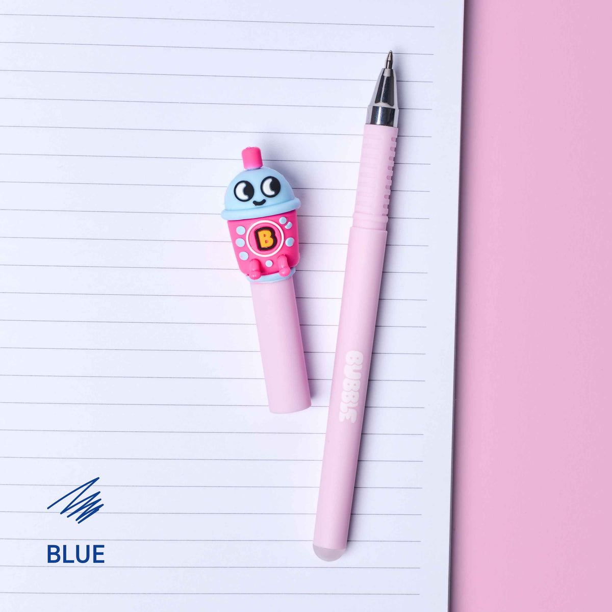 Pink pen with cartoon character on top of lined paper