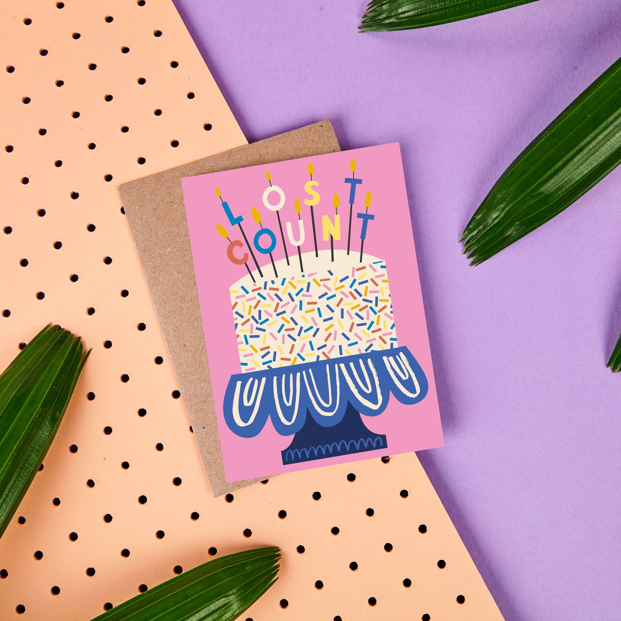 Birthday card with cake and candles design on a colorful background