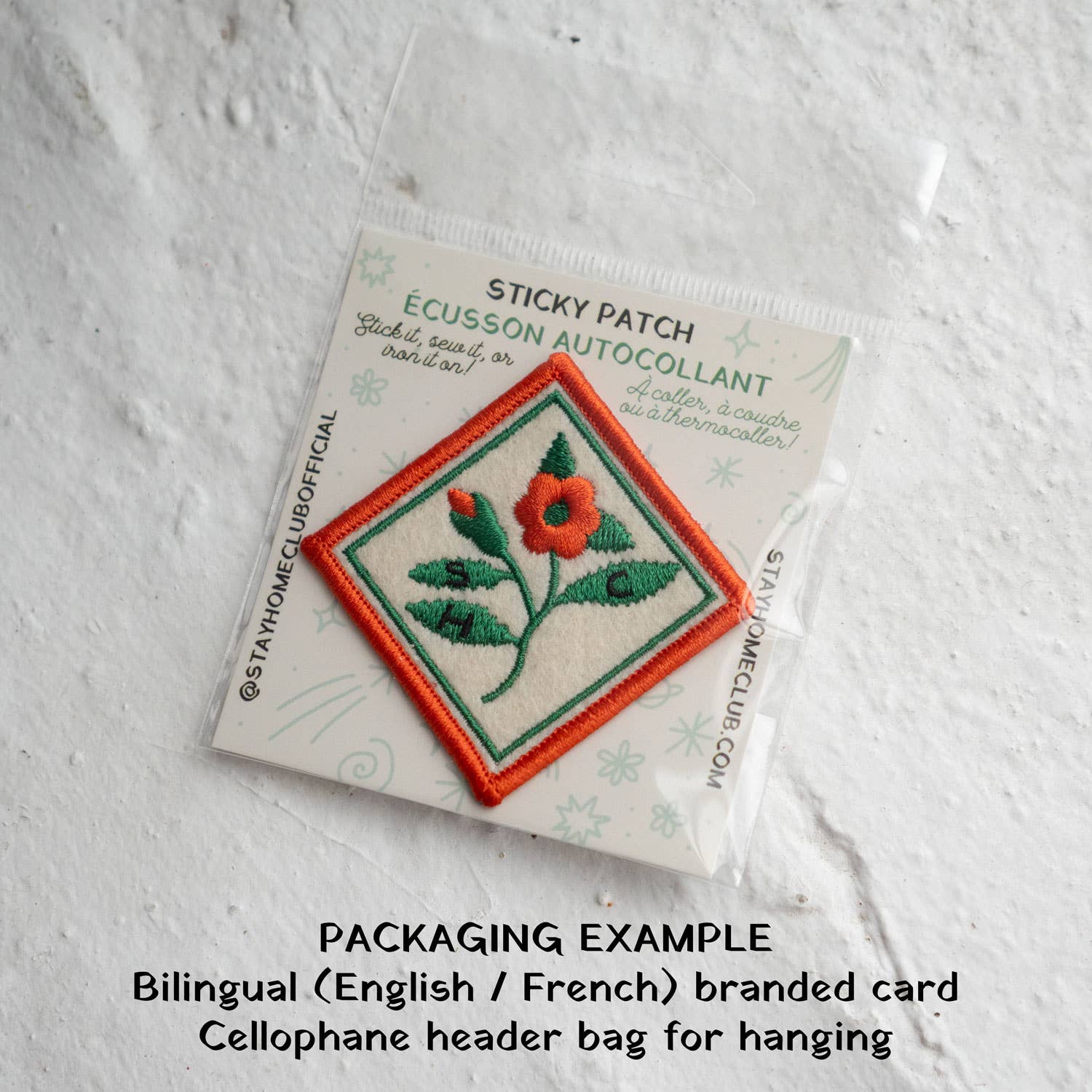 Sticky patch packaging with a flower design on a textured white background