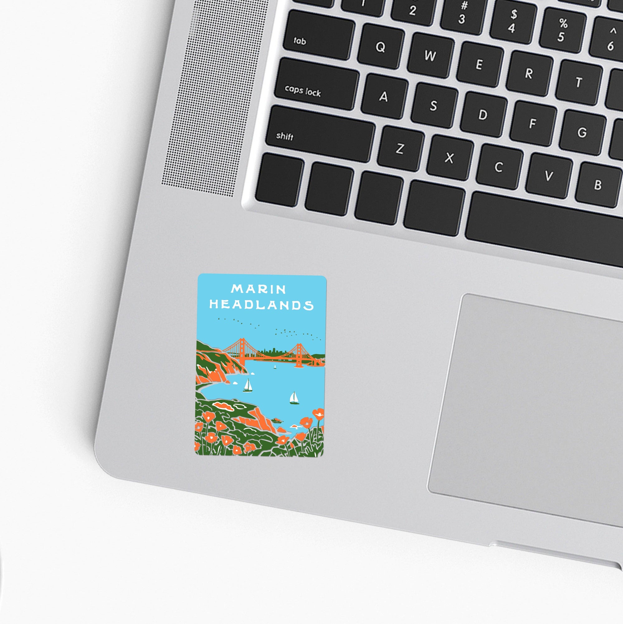 Laptop with a 'Marin Headlands' sticker on the palm rest area