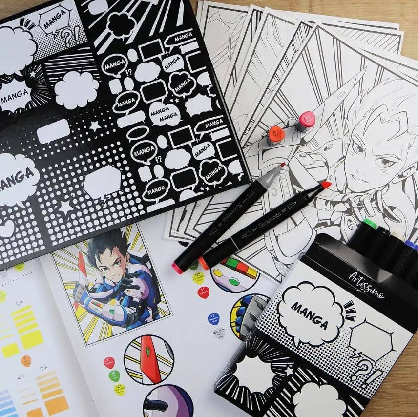 A manga coloring book set arranged on a light wood surface, featuring black-and-white manga panels, printed coloring pages, two black markers with pink tips, and several colored circular stickers. The visible product branding reads 'MANGA' and 'ArtVision'.