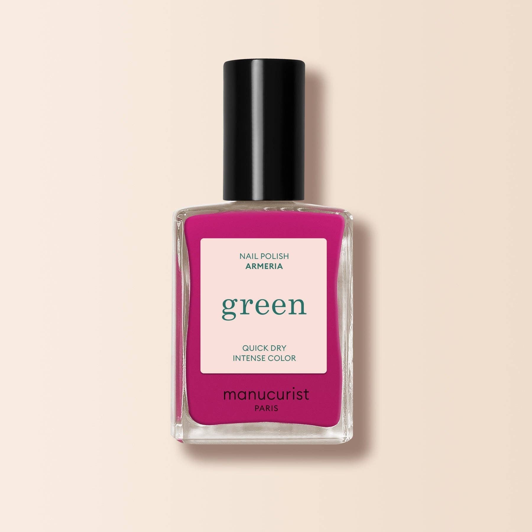Manucurist nail polish bottle with pink label on a beige background