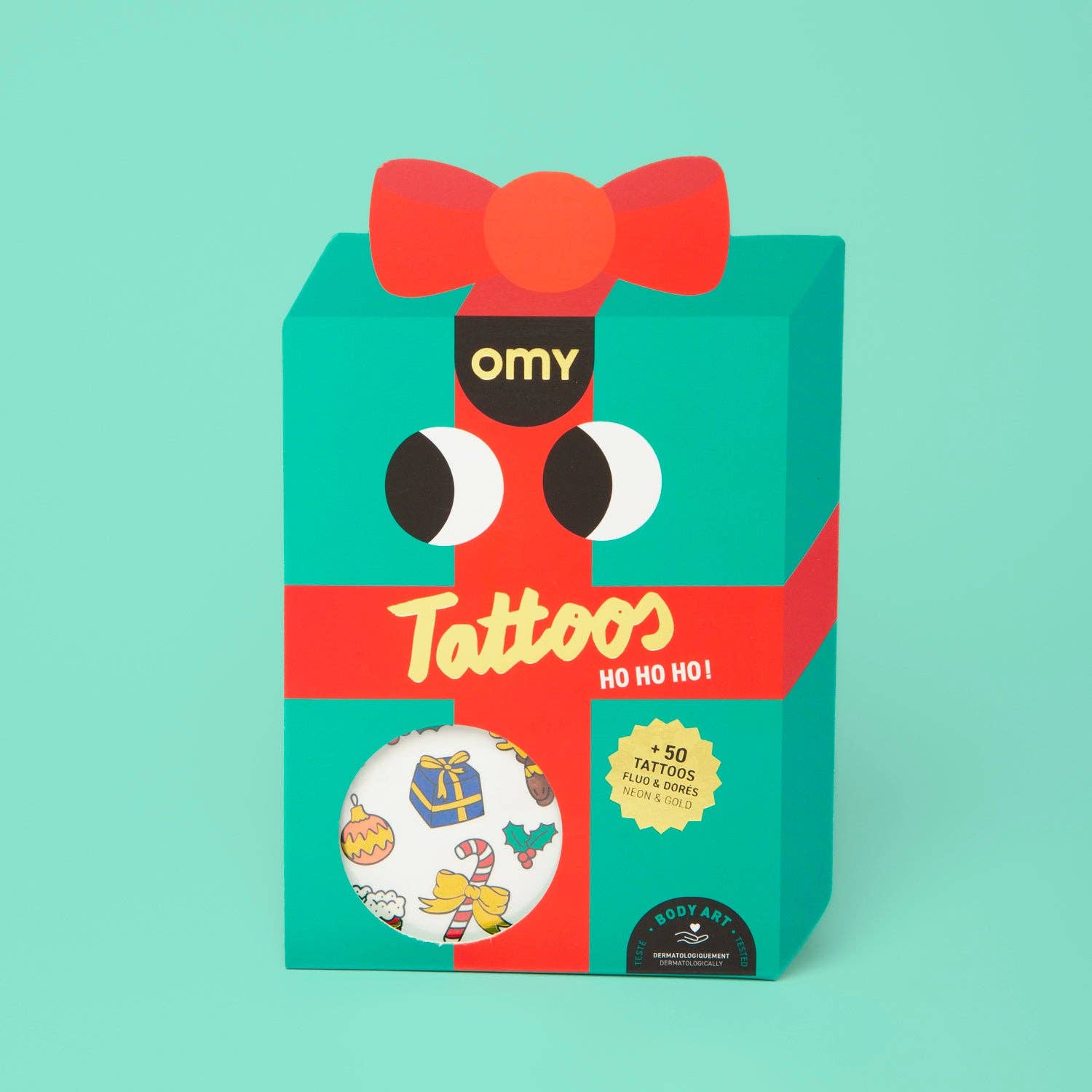 OMY tattoos with a red bow and Christmas-themed design on a teal background