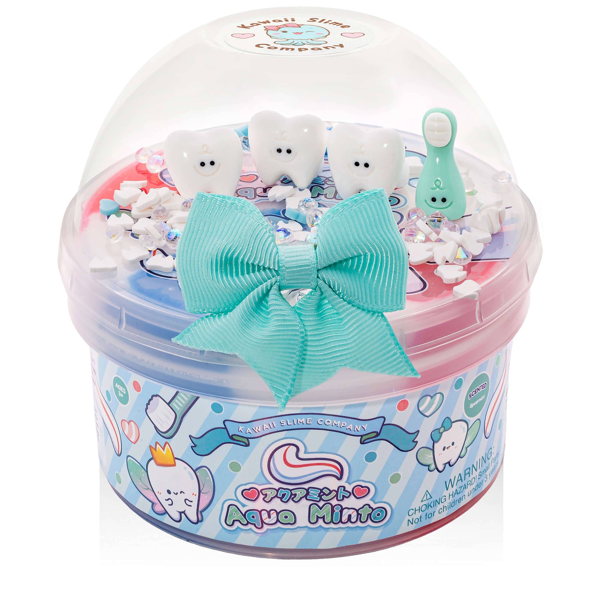 Toy set with tooth-themed figures and a large bow in a clear container labeled 'Aqua Minto'.