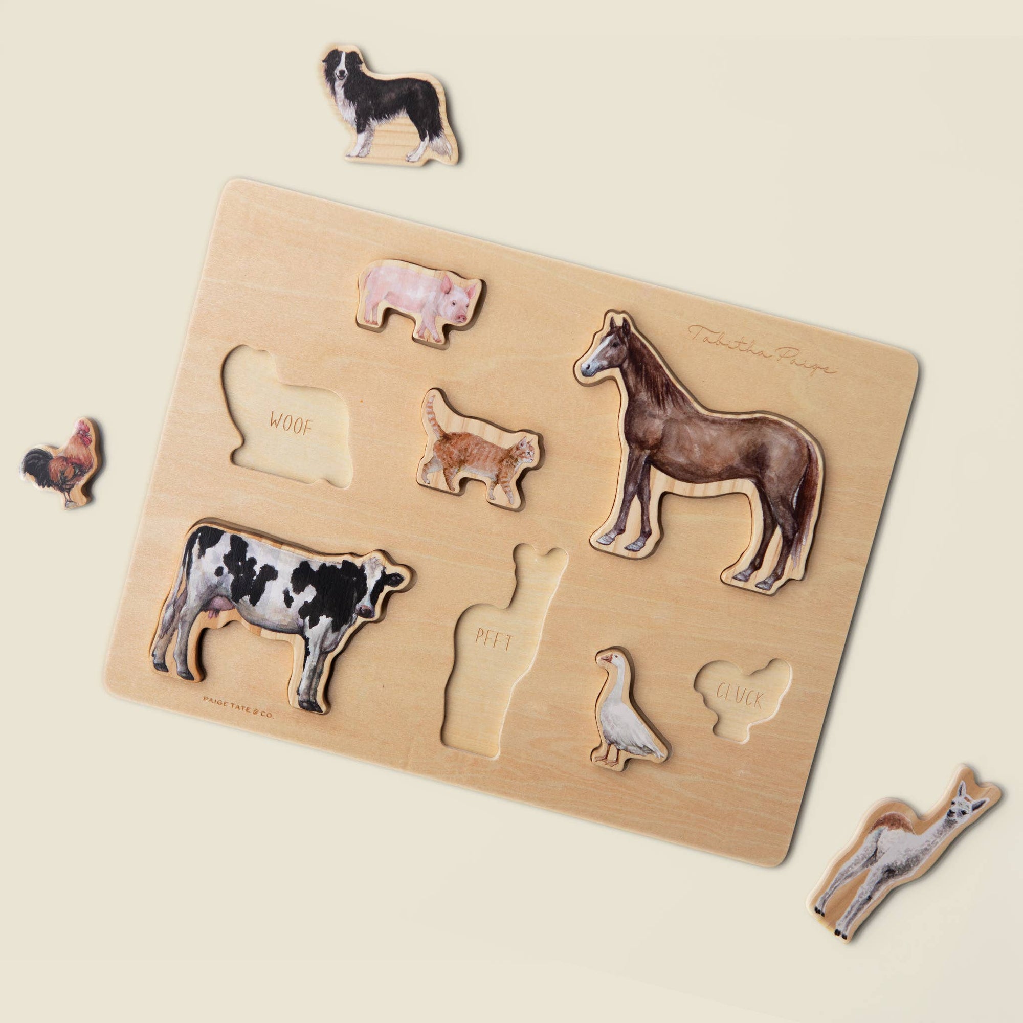 Wooden puzzle with animal figures on a beige background