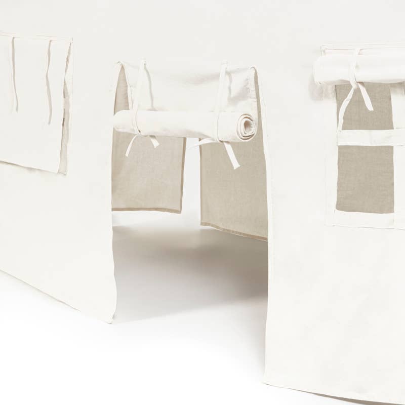 White curtains with beige lining on a white background