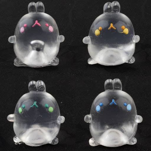 Four transparent animal figurines with colored facial features on a black background
