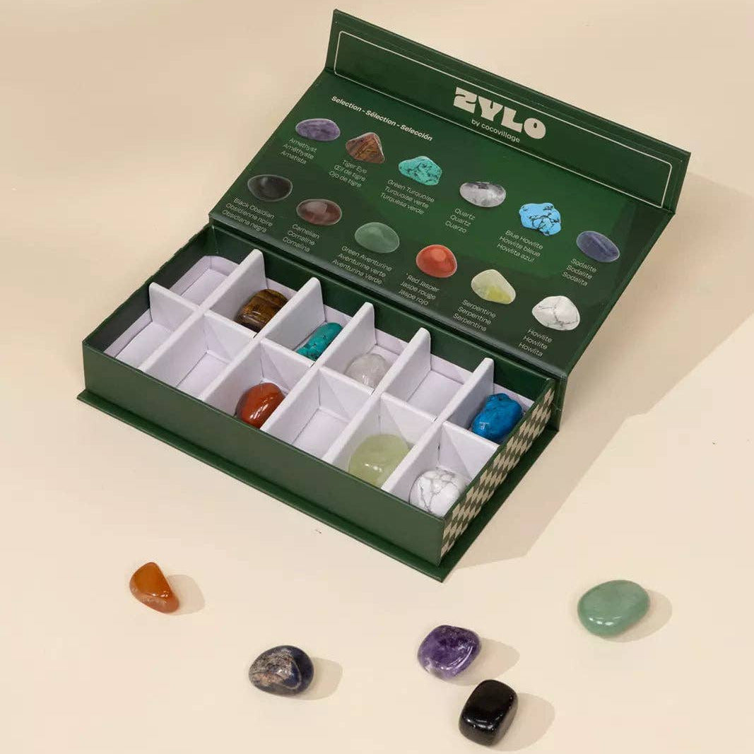 Zylo gemstone set with stones displayed on a beige background