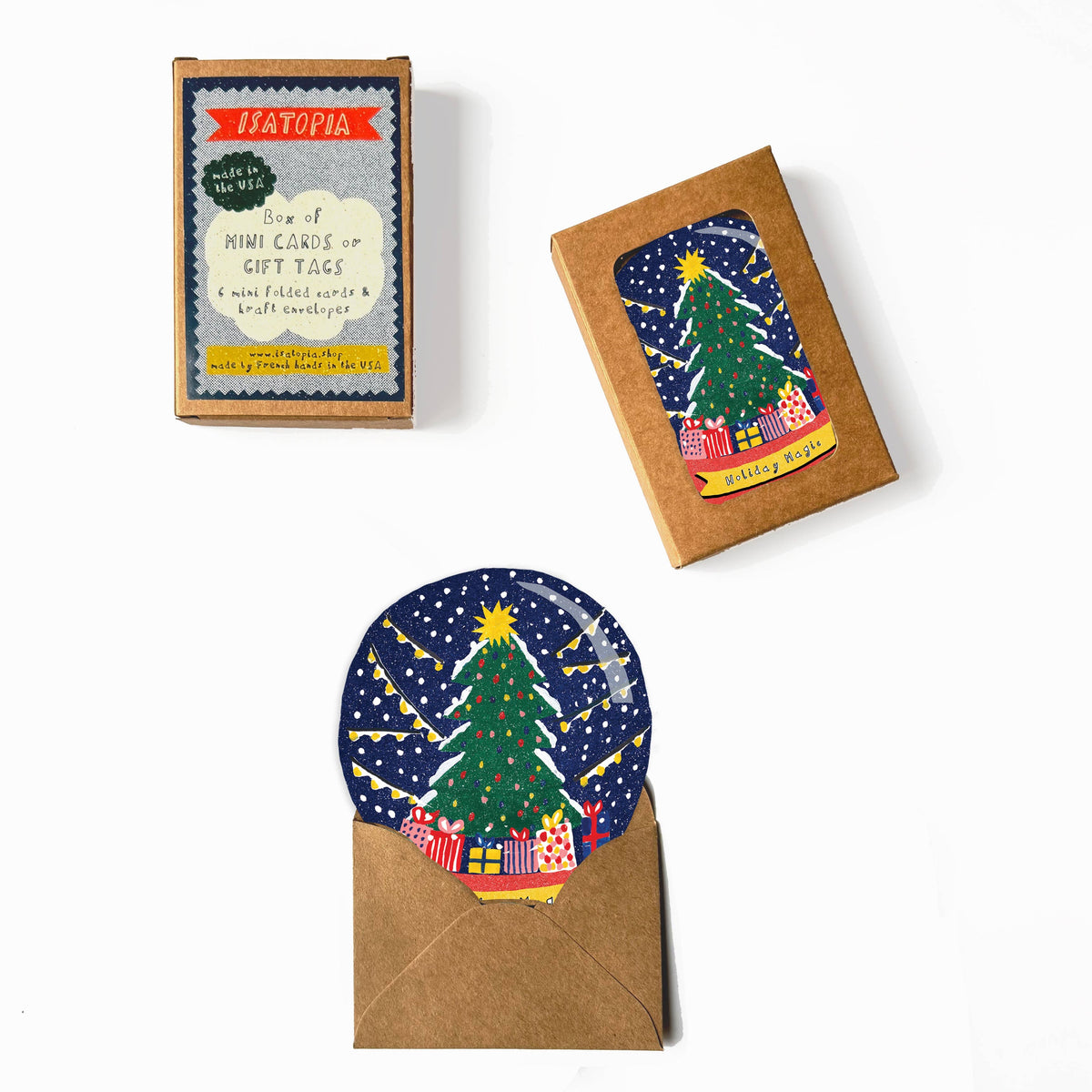 A set of handcrafted holiday gift tags and envelopes from the brand Hatofia, featuring a colorful folk-art Christmas tree design on a dark blue background, displayed on a clean white surface.
