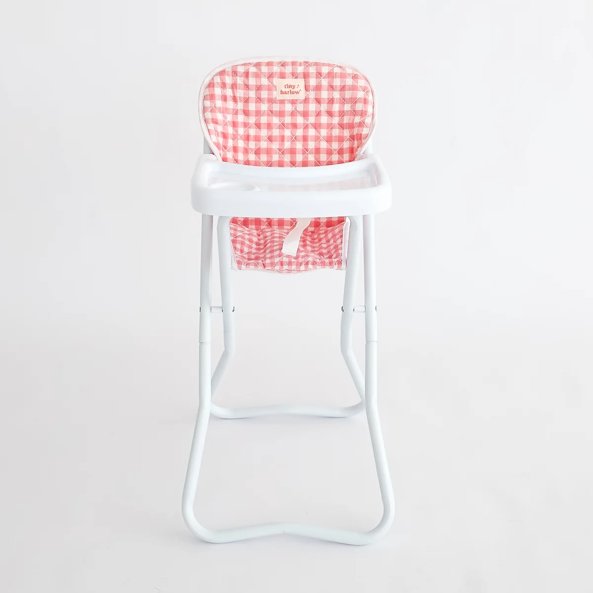 High chair with red and white checkered cushion on a light gray background
