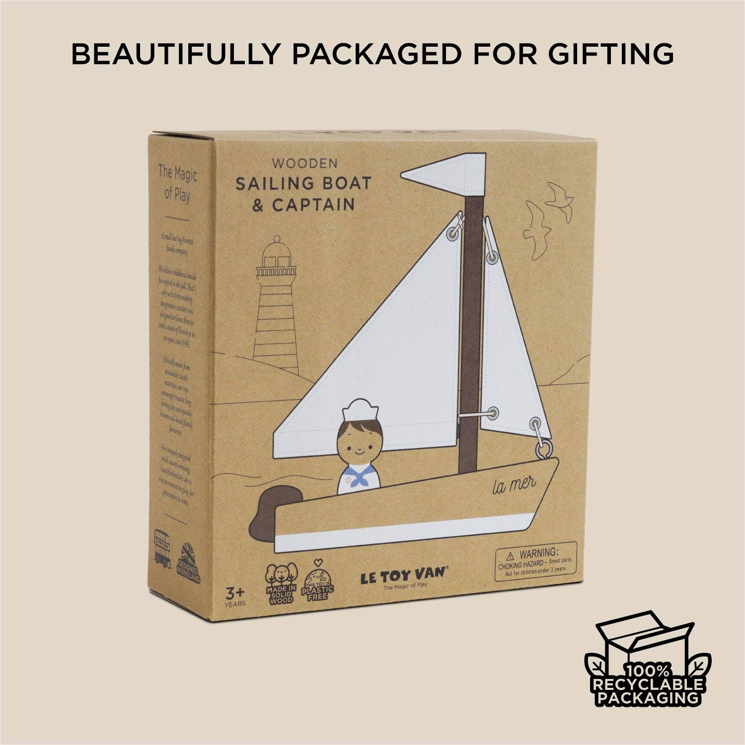 Box packaging of a wooden sailing boat and captain toy by Le Toy Van on a beige background.