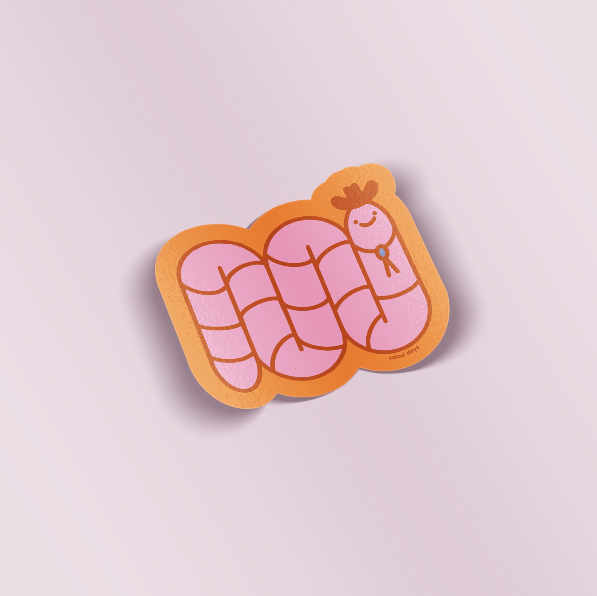 Pink cartoon worm on a waffle-shaped sticker with a light purple background