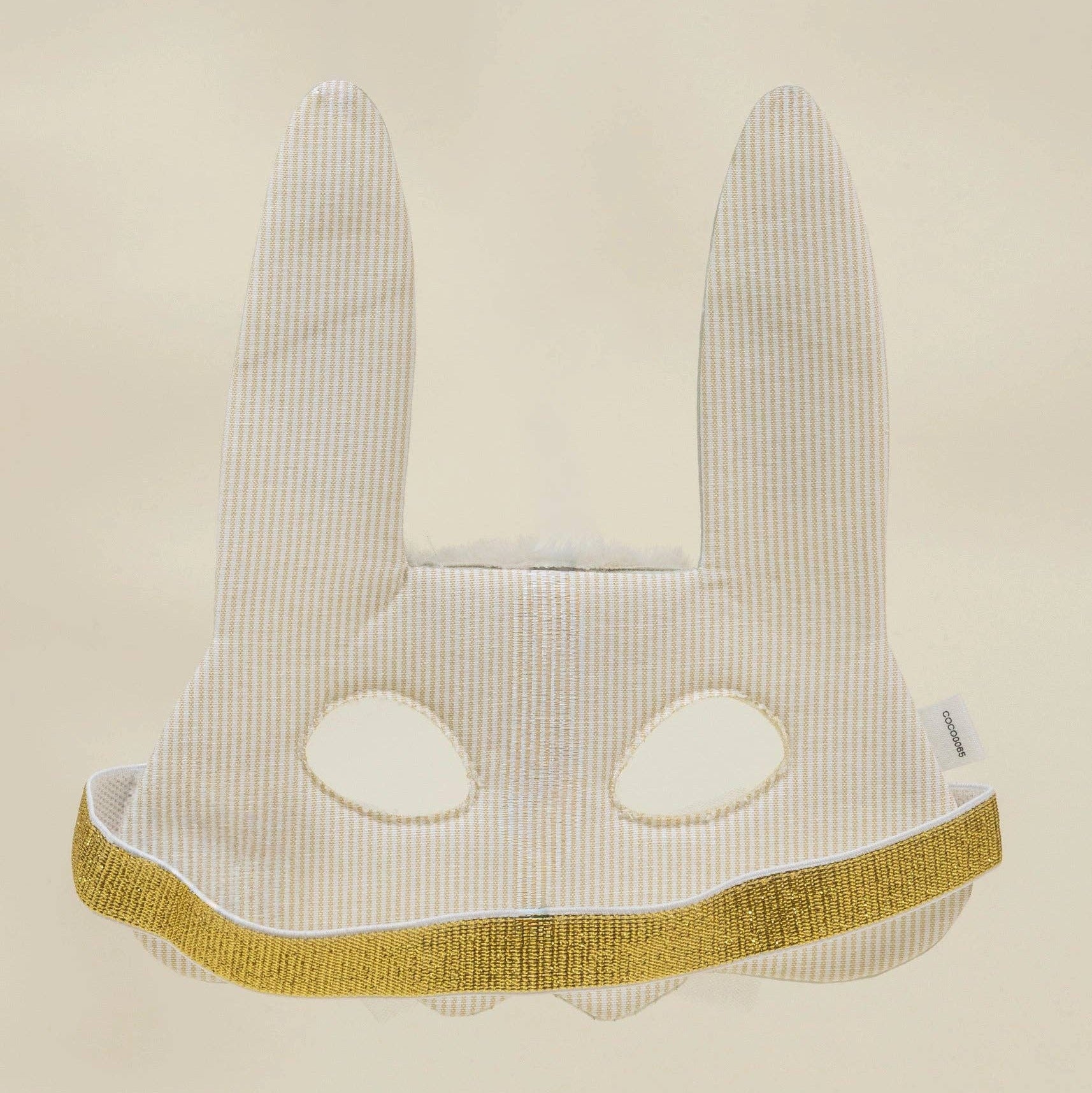 Cat-shaped headband with long ears and a yellow band on a beige background